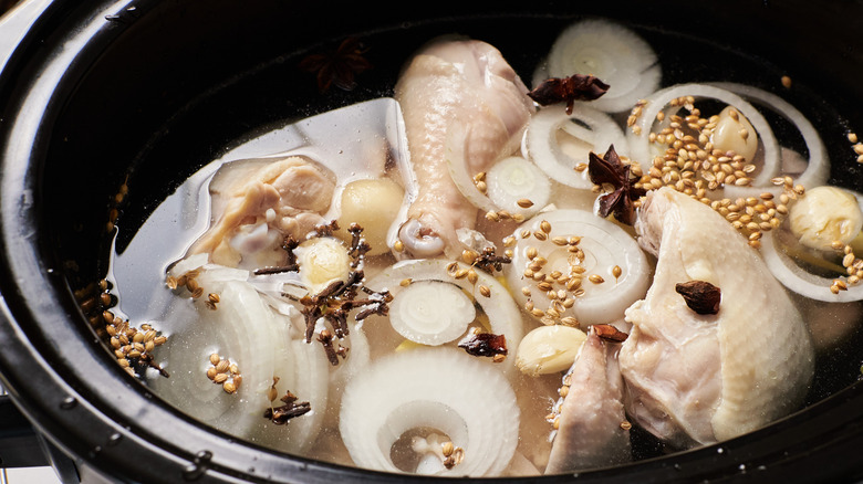 chicken and spices in crockpot