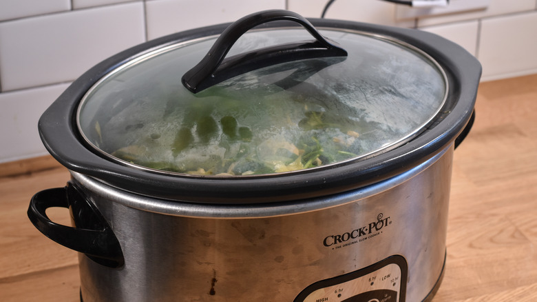 meal cooking in crockpot slow cooker