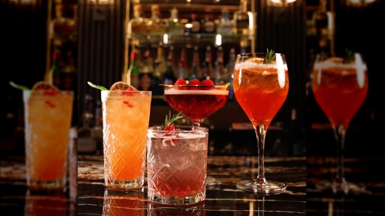 four different cocktails sitting ontop of a bar counter on Princess Cruise Line