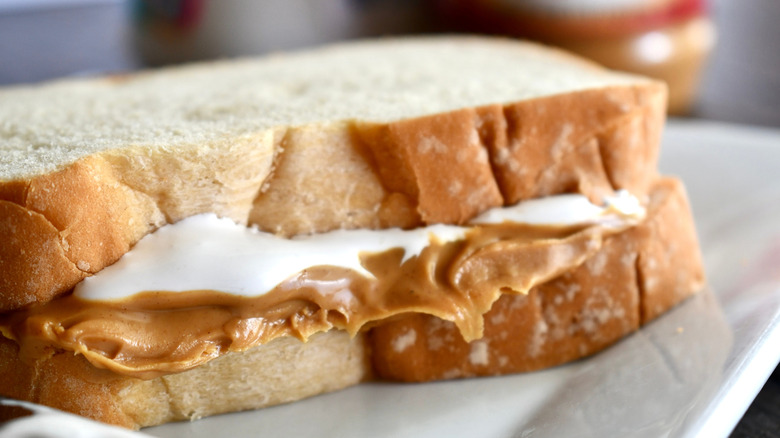 Closeup of fluffernutter sandwich with bread on plate