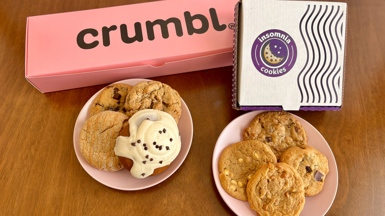 various cookies with Crumbl and Insomnia cookie boxes