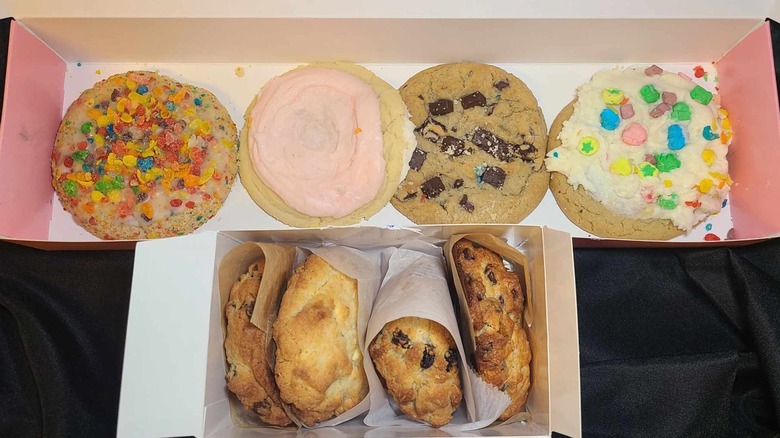 Boxes of 4 Crumbl cookies and 4 Levain cookies