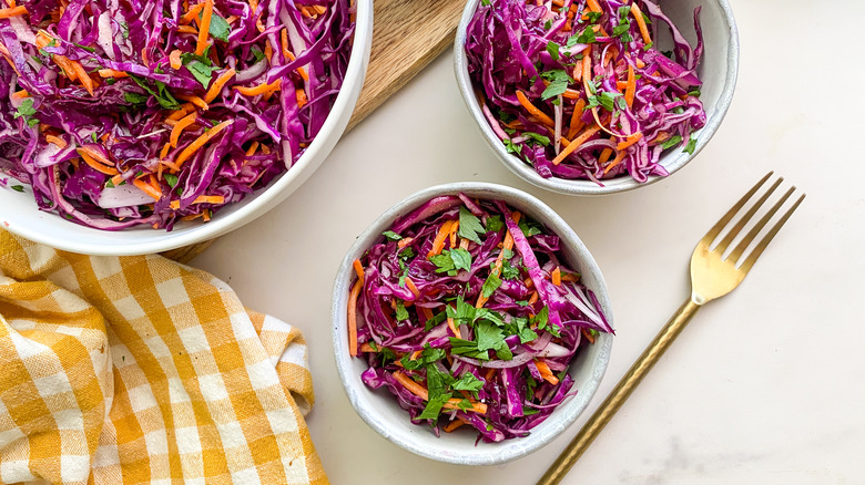 two bowls of purple cabbage salad