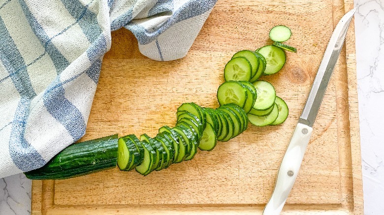 sliced cucumber on board