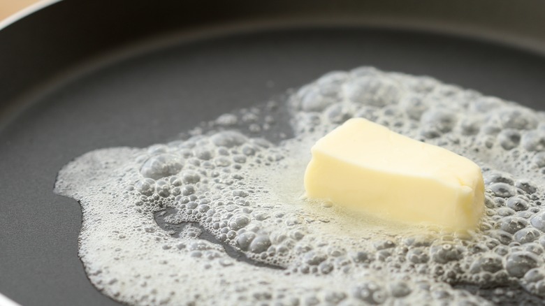 Butter in a hot frying pan