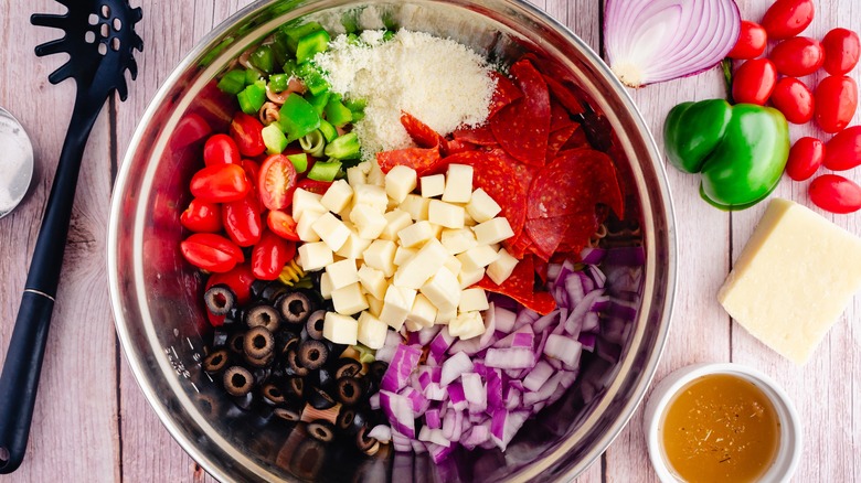 Pasta salad ingredients with vegetables and pepperoni