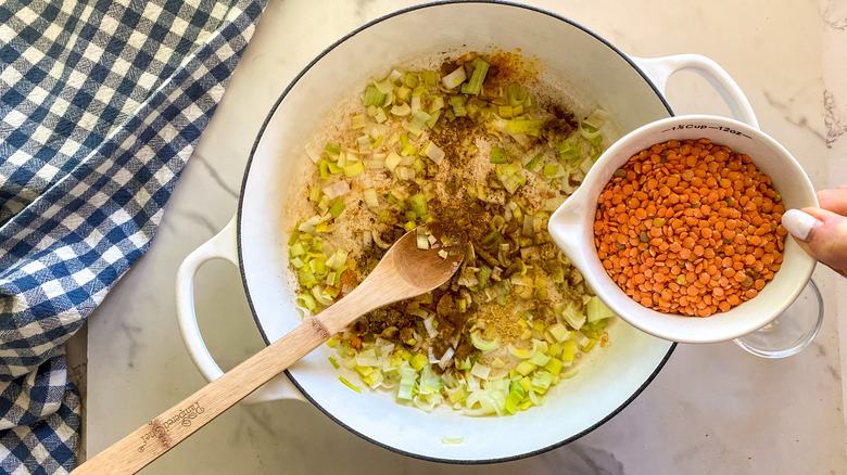 adding lentils to pot