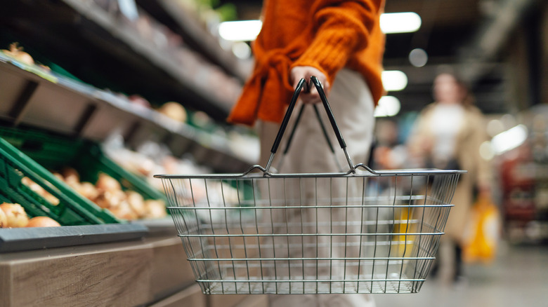 Woman holding shopping basket