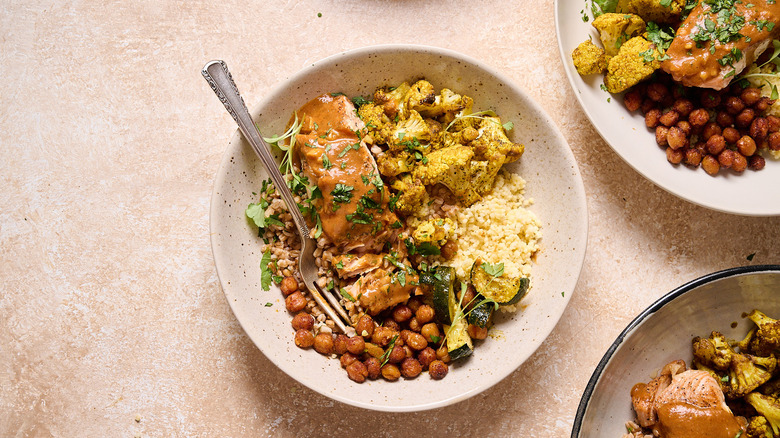 curry salmon grain bowl on table