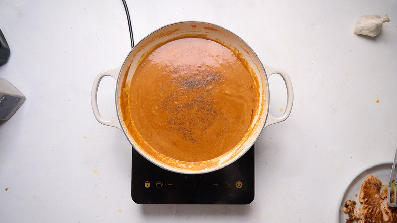 simmering curry sauce in skillet
