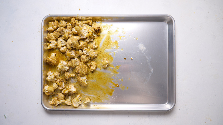 seasoned cauliflower on sheet tray