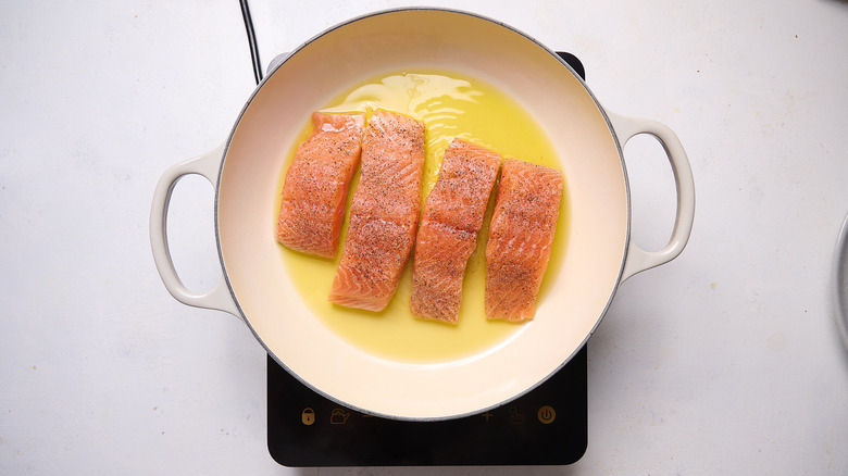 cooking salmon in a skillet