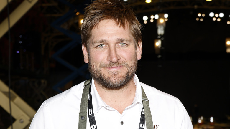 Curtis Stone smiling outside