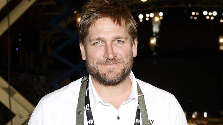 Curtis Stone posing outside at event