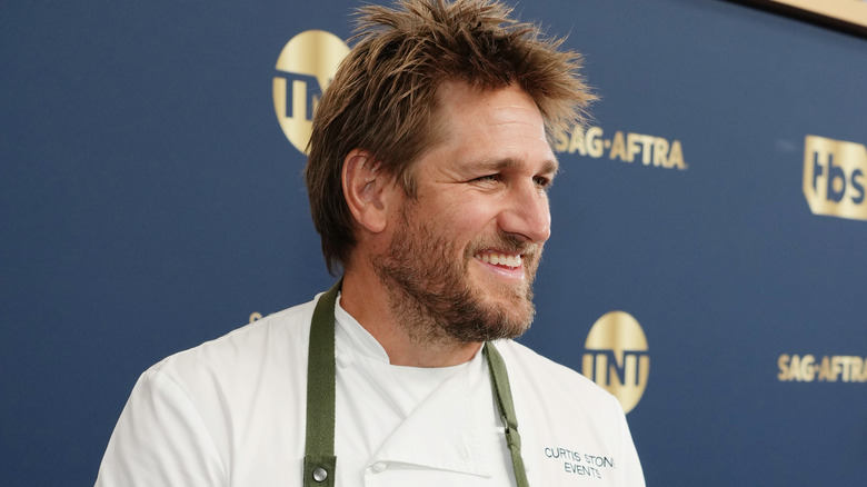 Curtis Stone smiling for press