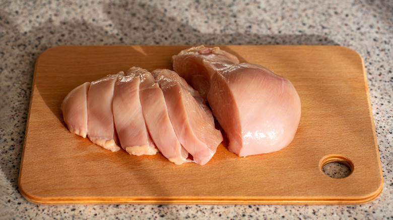 sliced chicken breast on a cutting board