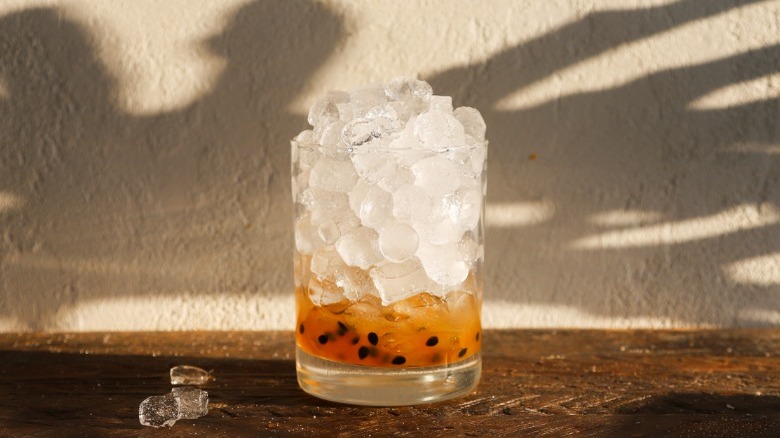 Glass with ice and passion fruit