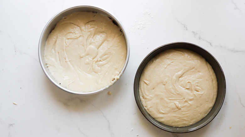 Batter in prepared cake pans