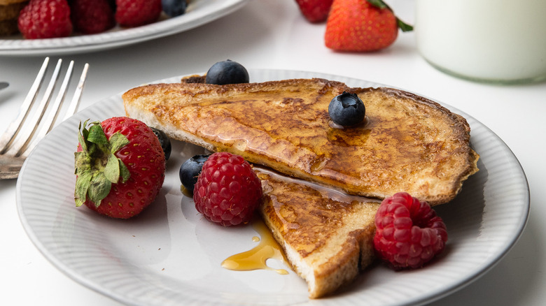 French toast on plate with berries