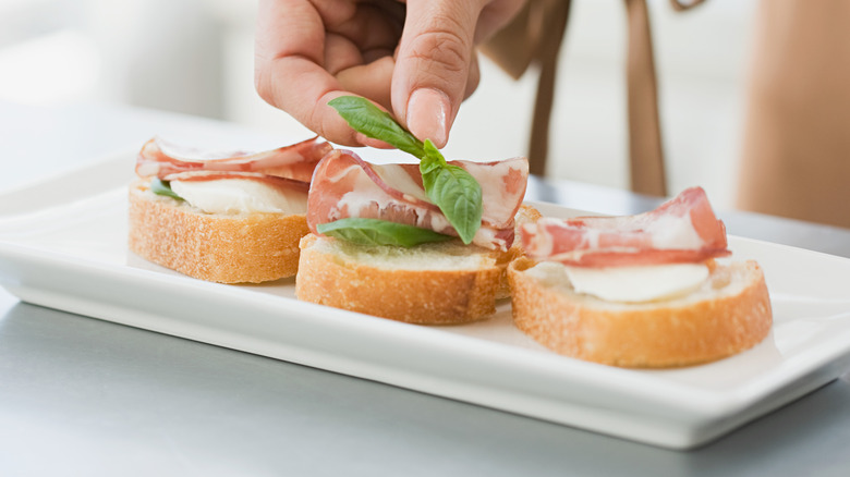 Hors d'oeuvres with cured meat on platter