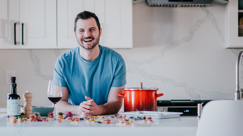 Danny Freeman smiling in kitchen