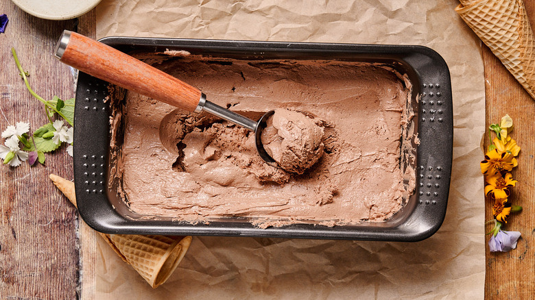 scooping frozen ice cream on table