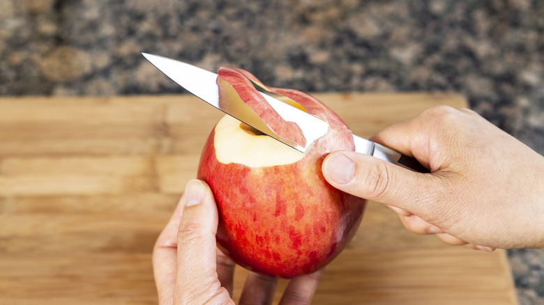 Paring knife and apple