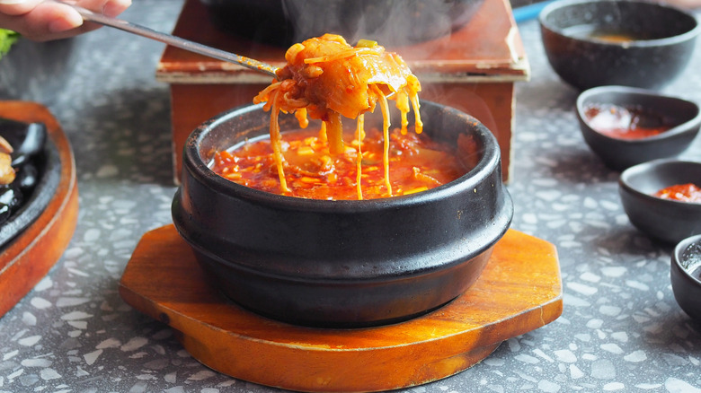 Kimchi jjigae in stone bowl