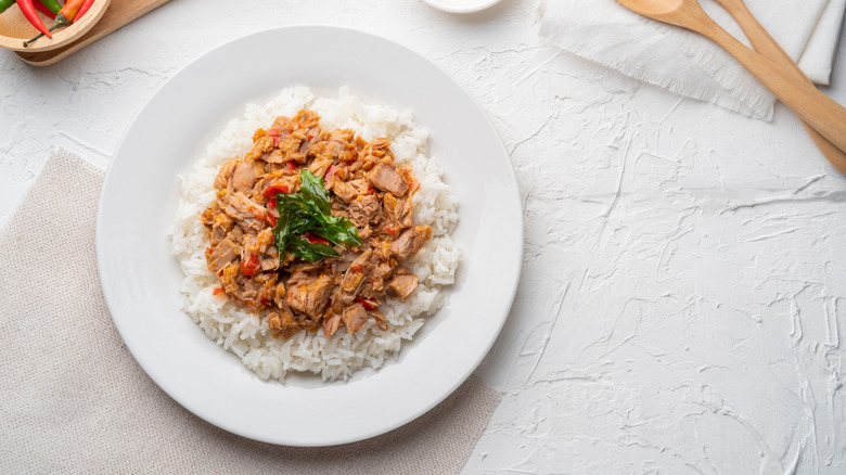 A bowl of white rice topped with hot pepper tuna