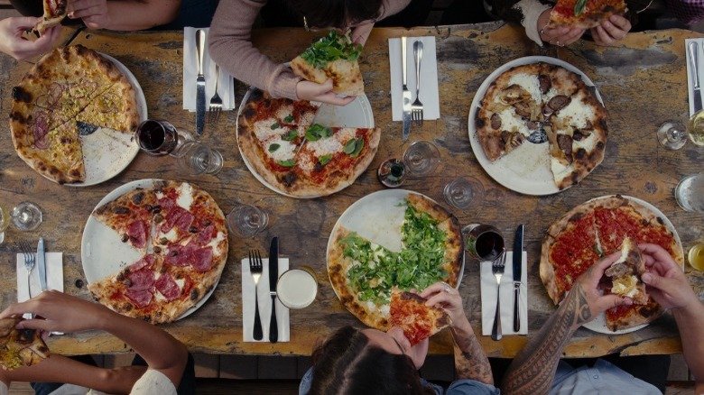 Large table with pizzas 