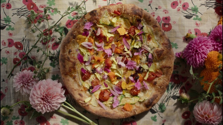 Pizza adorned with flowers 