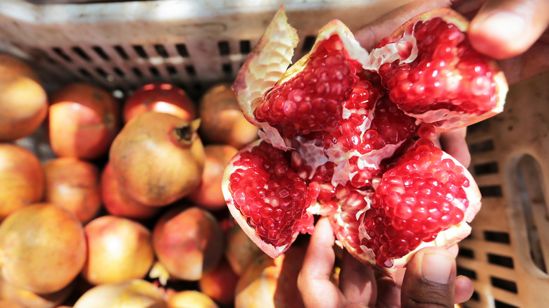 A pomegranate opened sectionally. 