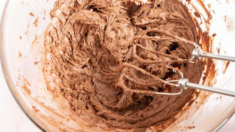 mixing chocolate frosting 