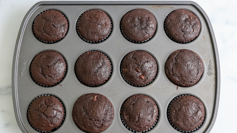 baked death by chocolate muffins in a pan