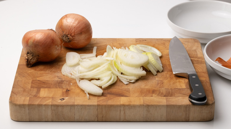sliced onions on chopping board