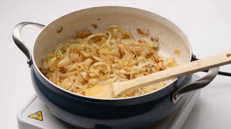 caramelizing onions in a pan