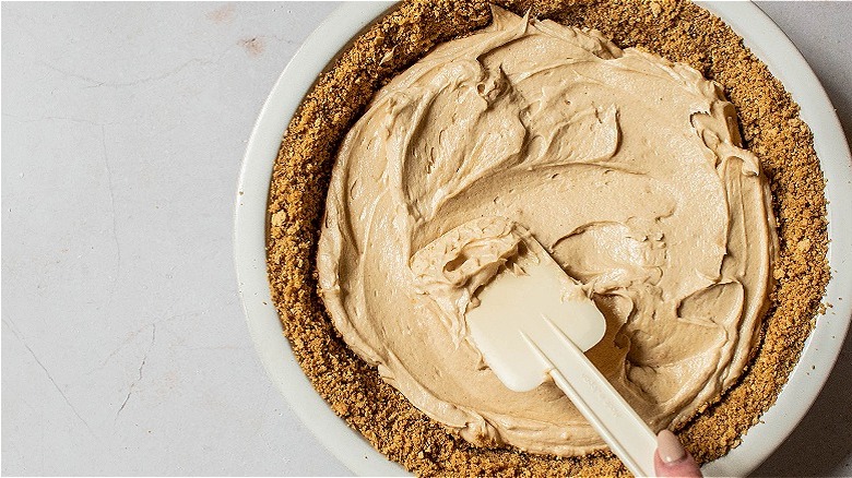 spreading filling into pie crust