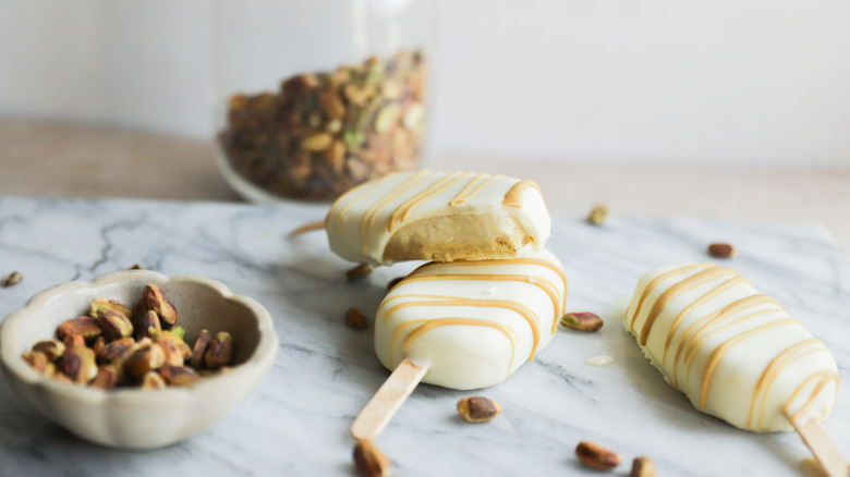 Stack of white chocolate popsicles