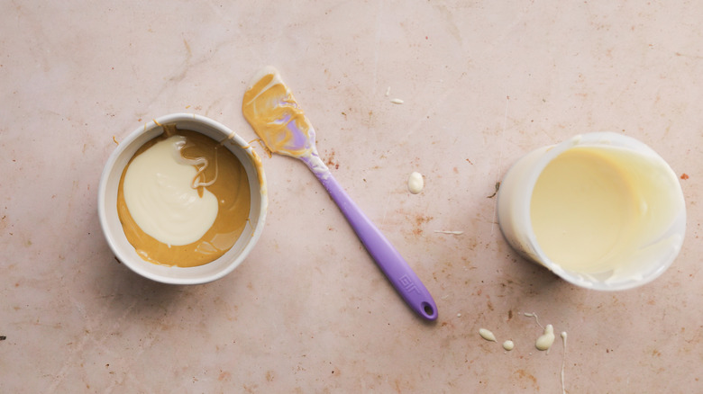 Bowl of white chocolate and pistachio paste