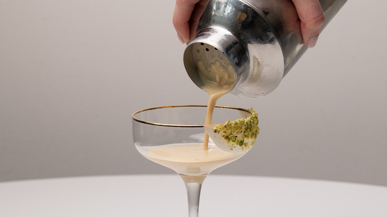 pouring white chocolate pistachio martini