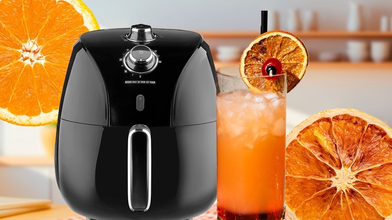 Air fryer and cocktail garnished with orange