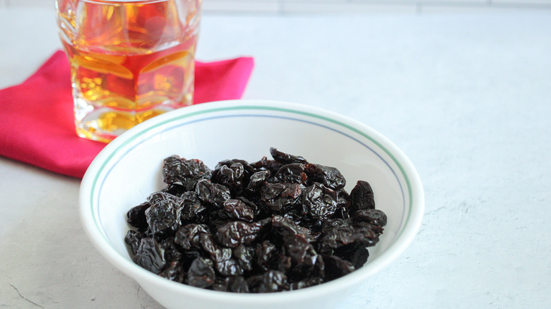 A bowl of cherries with bourbon