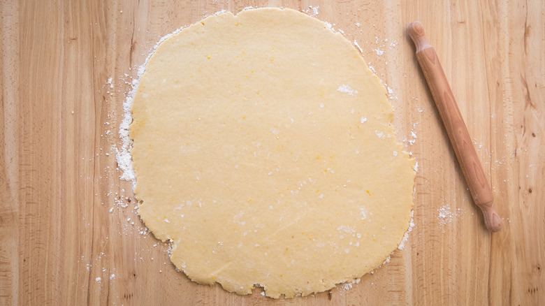 dough rolled out on table