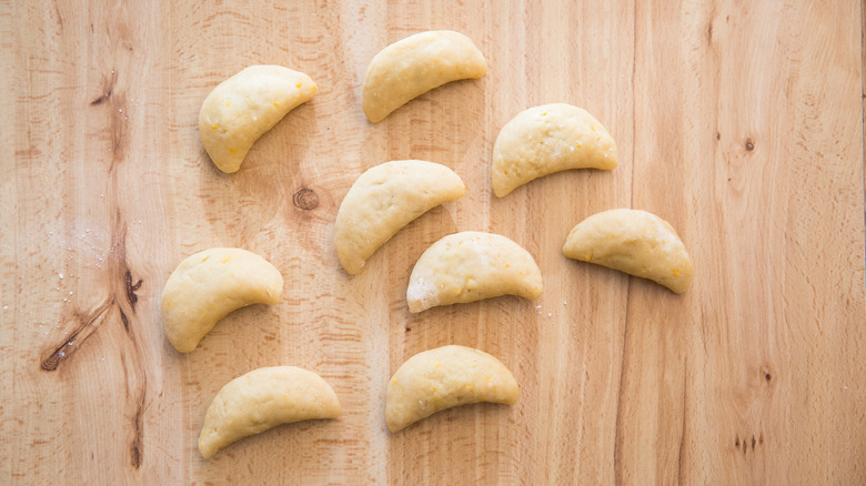 unbaked cuccidati cookies on table