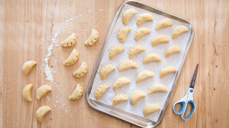 unbaked cuccidati cookies on tray