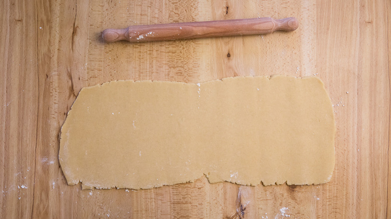 rolled out dough on table