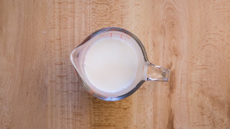 milk in small measuring cup