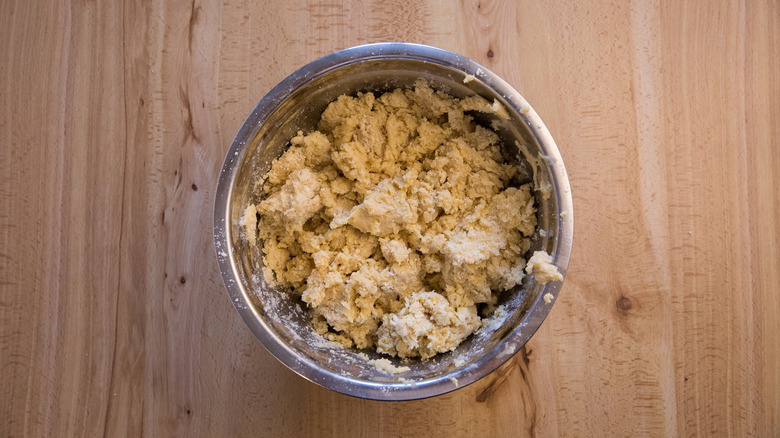 crumbly dough in mixing bowl