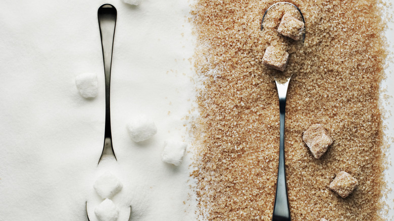 spoons of white and raw sugar