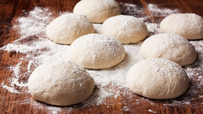 floured balls of pizza dough